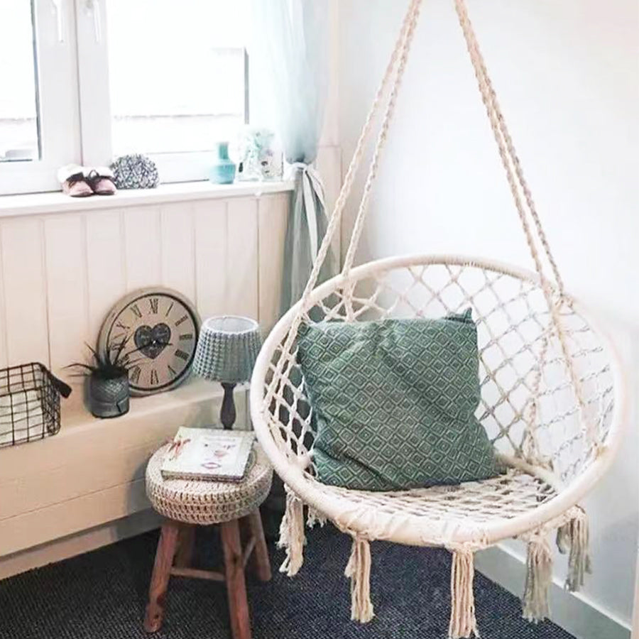A swing chair in a Bohemian style with fringed design is foldable. Suitable for the garden. Outdoor use for gardens