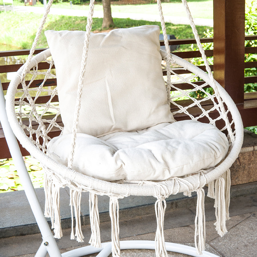 A swing chair in a Bohemian style with fringed design is foldable. Suitable for the garden. Outdoor use for gardens