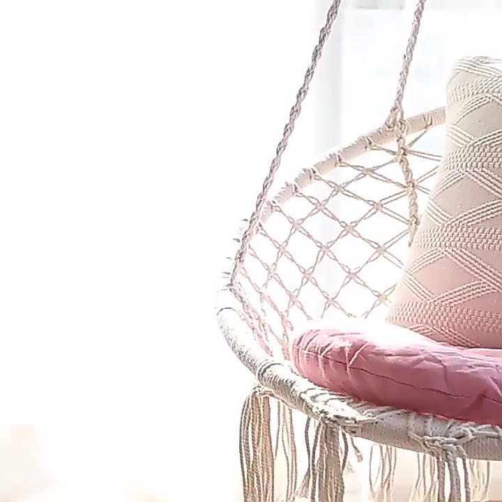 A swing chair in a Bohemian style with fringed design is foldable. Suitable for the garden. Outdoor use for gardens